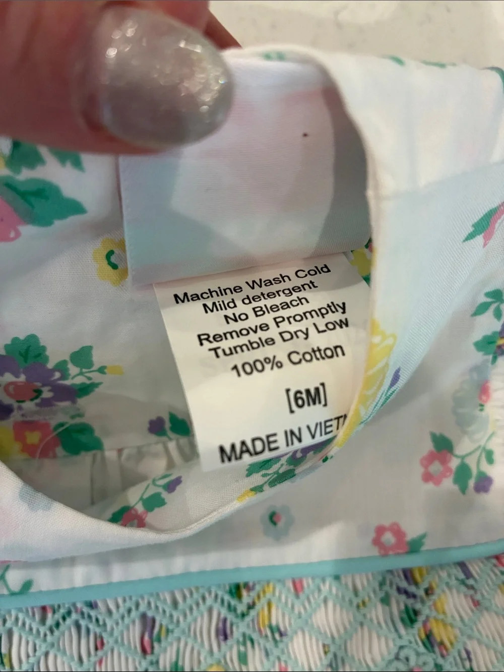 Floral Smocked Baby Romper - White with Yellow, Purple & Green Flowers